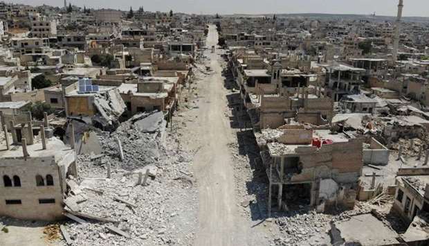 An aerial view taken on August 3, 2019, shows destroyed buildings in the town of Khan Sheikhun in the southern countryside of Idlib.
