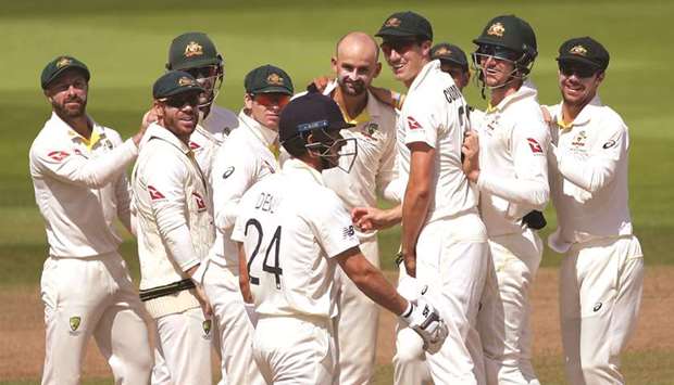 Australiau2019s Nathan Lyon celebrates the wicket of Englandu2019s Joe Denly with teammates on the last day of the first Ashes Test at Edgbaston yesterday. (Reuters)
