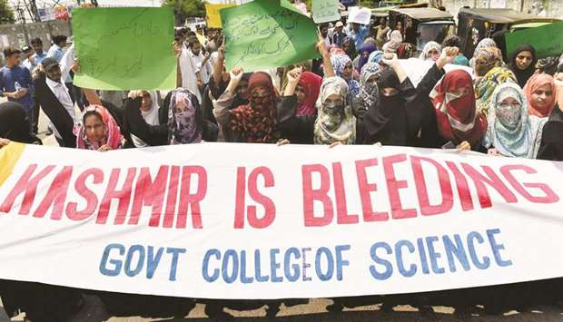 Students chant slogans during a protest rally in Lahore.