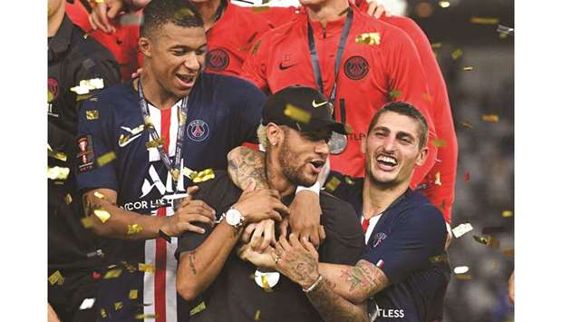 Paris Saint-Germainu2019s Kylian Mbappe (left), Neymar (centre) and Marco Verratti celebrate after winning the French Trophy of Champions on Saturday. (AFP)