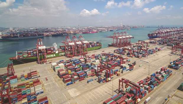 Containers stacked at Qingdao port in Shandong province. Chinau2019s July exports rose 3.3% from a year earlier but imports remained weak, declining 5.6%.
