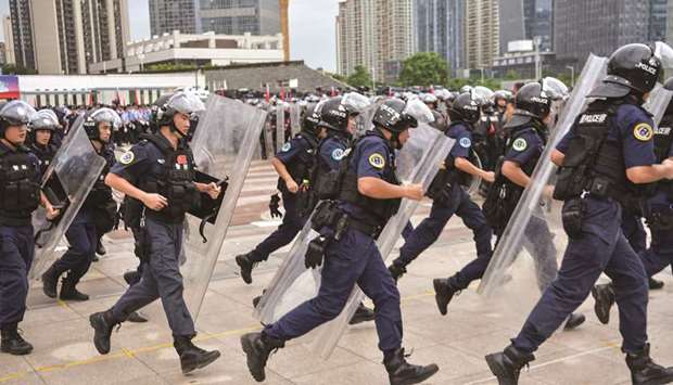 Chinese police officers taking part in a drill in Shenzhen in Chinau2019s southern Guangdong province, across the border from Hong Konag.