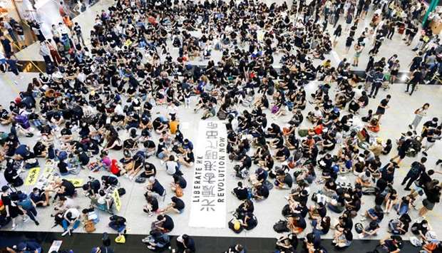 Anti-extradition bill demonstrators attend a protest at the arrival hall of Hong Kong Airport