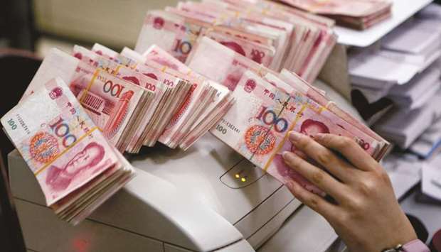 The yuan inched down against the dollar yesterday as traders awaited Beijing and Washingtonu2019s next moves in their bruising tariff tussle, taking a breather after a rapid sell-off earlier this week that sparked fears of an all-out currency war