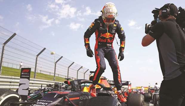 Red Bullu2019s Max Verstappen jumps out of his car after winning the 70th Anniversary Grand Prix at Silverstone yesterday. (AFP)