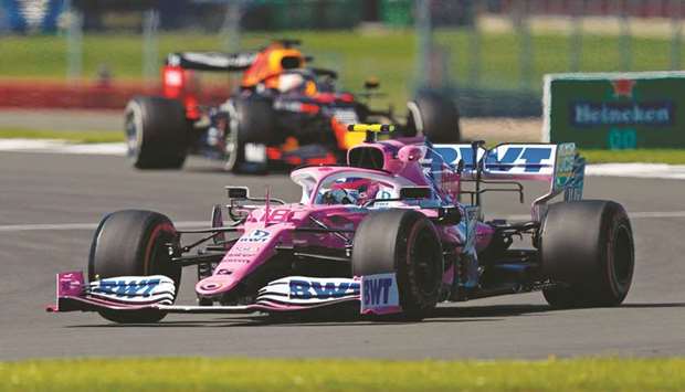 Racing Point driver Lance Stroll steers his car during the first practice session for the British Grand Prix at the Silverstone circuit yesterday. (Below) Nico Hulkenberg. (AFP / RacingPointF1)
