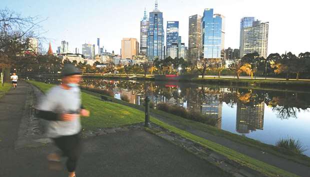 A jogger exercises by the Yarra River as the city operates under lockdown restrictions to curb the spread of the coronavirus disease (Covid-19) in Melbourne, yesterday.