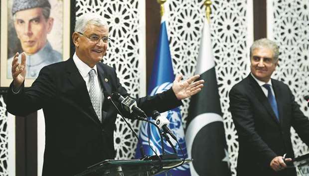 Bozkir gestures while speaking at the joint press conference with Qureshi in Islamabad.
