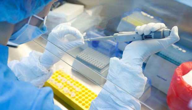 A scientist prepares samples during the research and development of a vaccine against the coronavirus disease at a laboratory of BIOCAD biotechnology company in Saint Petersburg, Russia, June 11.