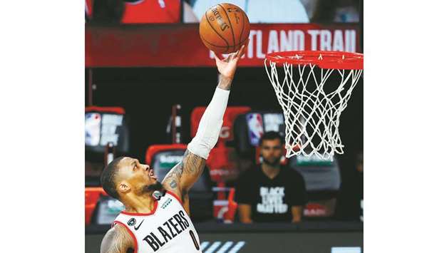 Damian Lillard of the Portland Trail Blazers goers up for a shot against the Philadelphia 76ers during the fourth quarter of their NBA game at Visa Athletic Center at ESPN Wide World Of Sports Complex in Lake Buena Vista, Florida.  (USA TODAY Sports)
