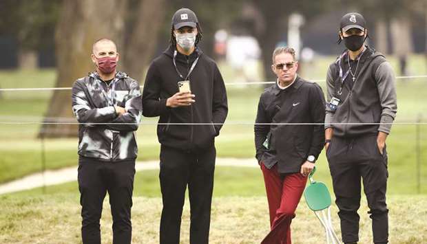Golf Instructor Sean Foley (second from right) and NBA stars Damion Lee (second from left) and Stephen Curry (right) watch play on the seventh green during the final round of the 2020 PGA Championship at TPC Harding Park in San Francisco, California. (Getty Images/AFP)