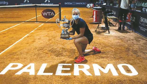 Fiona Ferro (also inset) of France poses with the winneru2019s trophy at the end of Palermo Ladies Open in Palermo, Italy, on Sunday. (Palermo Ladiesu2019 Open)