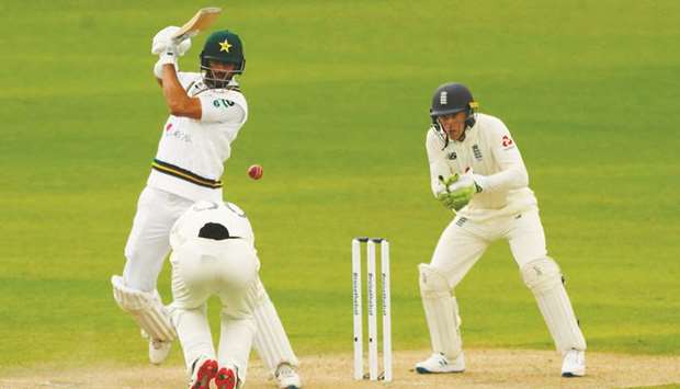 Pakistanu2019s Shan Masood plays a shot on the first day of the first Test against England at Old Trafford in Manchester, United Kingdom, on on August 5, 2020. (AFP)