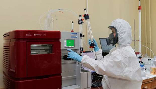 A scientist works inside a laboratory of the Gamaleya Research Institute of Epidemiology and Microbiology during the production and laboratory testing of a vaccine against the coronavirus disease, in Moscow, Russia August 6
