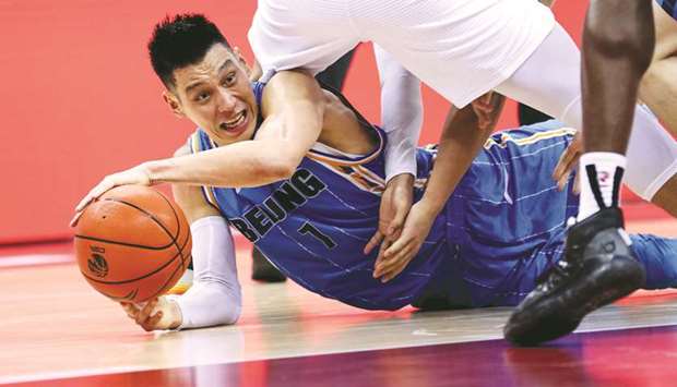 This file photo taken on August 4 shows Beijing Ducksu2019 Jeremy Lin falling during the Chinese Basketball Association (CBA) match between the Beijing Ducks and Guangdong Southern Tigers in Qingdao in Chinau2019s eastern Shandong province.