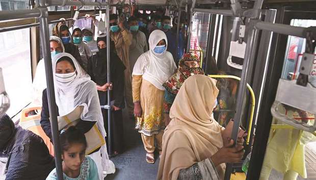Commuters travel yesterday in a Metrobus in Lahore. Metro bus services in Islamabad and sister city Rawalpindi were restored yesterday.