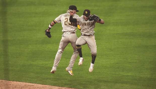 San Diego Padres shortstop Fernando Tatis Jr. (23) celebrates with left fielder Tommy Pham (28) after the game against the Colorado Rockies.