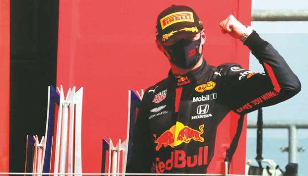 Red Bull driver Max Verstappen celebrates on the podium after winning the 70th Anniversary Grand Prix at Silverstone on Sunday. (AFP)