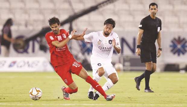Al Saddu2019s Rodrigo Tabata (right) and Al Duhailu2019s Sultan al-Brake vie for the ball during their QNB Stars League match at Jassim Bin Hamad Stadium on Saturday.