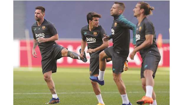 Barcelonau2019s captain Lionel Messi (left) takes part in a training session with teammates at the Luz stadium in Lisbon yesterday. (AFP)