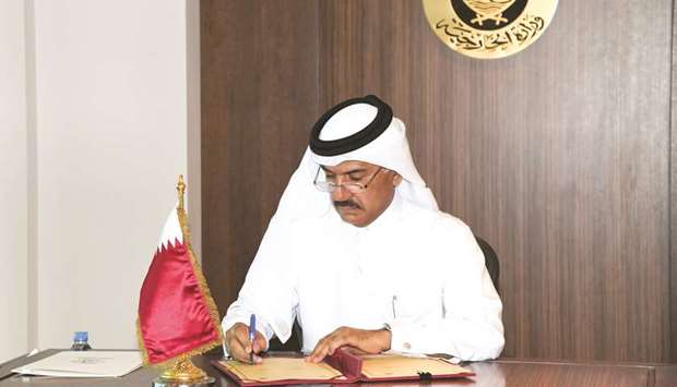 HE al-Hammadi signing the agreement.