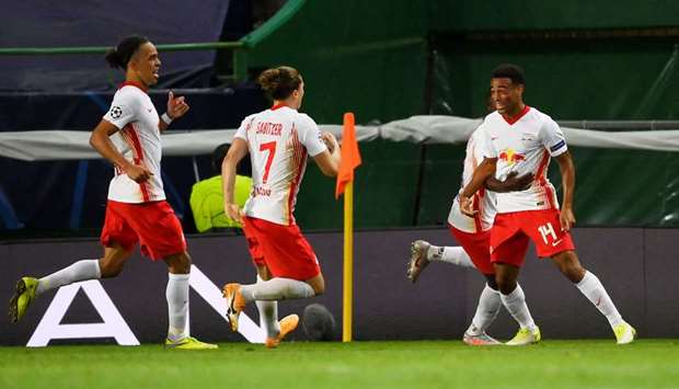 RB Leipzigu2019s Tyler Adams celebrates scoring the second goal with teammates.