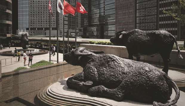 Bull statues displayed outside the Hong Kong Stock Exchange. The Hang Seng closed up 0.2% to 25,284.88 points yesterday.