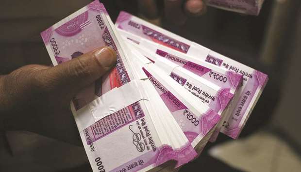 The rupee settled 6 paise lower at 74.90 against the US dollar yesterday tracking weak domestic equities