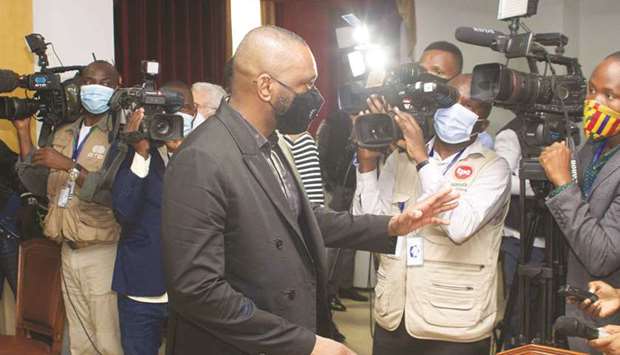 Jose Filomeno dos Santos gestures to journalists in Luanda, yesterday.