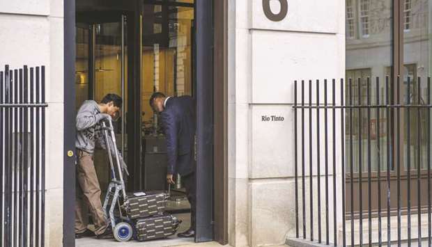 A courier delivers parcels to the Rio Tinto offices in London. Rio must decide whether itu2019s prepared to spend the large amounts needed to extract and transport the super-rich ore from its part of the Simandou iron ore project in Guinea.