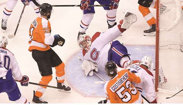 Montreal Canadiens goaltender Carey Price (centre) sprawls to make a save against the Philadelphia Flyers during game two of the first round of the Stanley Cup Playoffs in Toronto on Friday. (USA TODAY Sports)