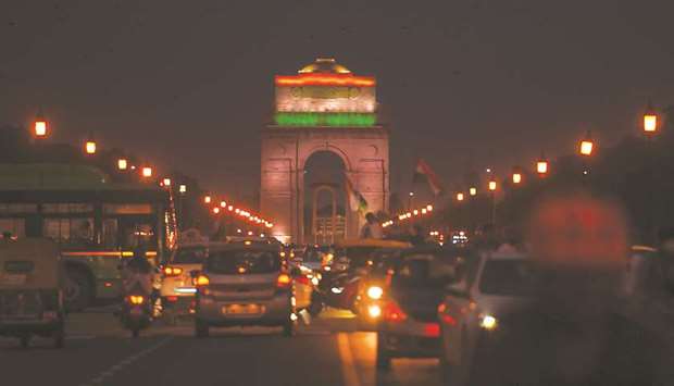 A general view shows traffic in front of the illuminated India Gate on the occasion of the Indiau2019s 74th Independence Day in New Delhi yesterday.