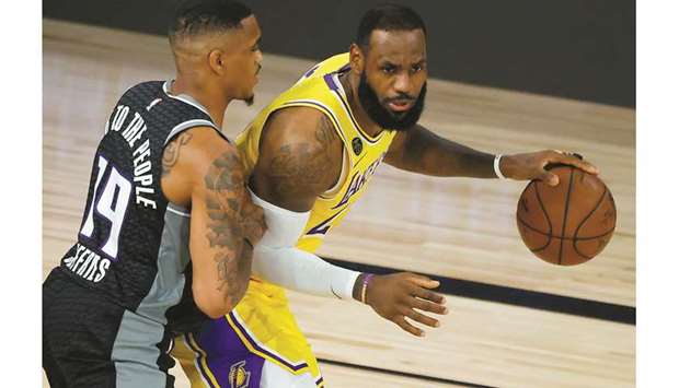 File photo of DaQuan Jeffries (L) of the Sacramento Kings defending against LeBron James of the Los Angeles Lakers on August 13 in Lake Buena Vista, Florida.