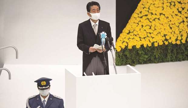 Japanu2019s Prime Minister Shinzo Abe makes a speech during a memorial service marking the 75th anniversary of Japanu2019s surrender in World War II at the Nippon Budokan hall in Tokyo, yesterday.