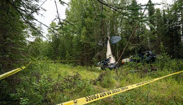 Wreckage the midair collision seen in the woods near the Sterling Highway and Mayoni Street in Soldotna. Picture courtesy of Anchorage Daily News