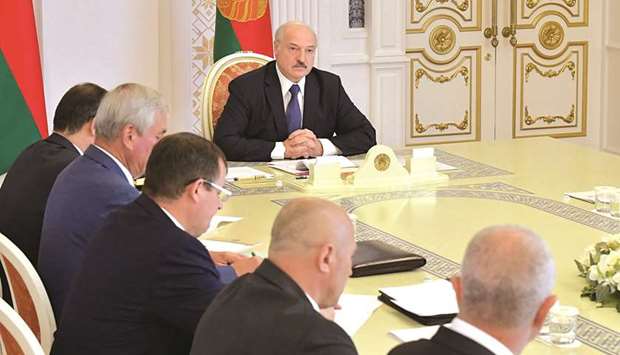 Belarusian President Alexander Lukashenko chairs a meeting with members of the Security Council in Minsk, Belarus, yesterday.