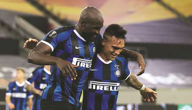 Inter Milanu2019s Romelu Lukaku (left) celebrates with teammate Lautaro Martinez after scoring during the UEFA Europa League semi-final against Shakhtar Donetsk in Duesseldorf, western Germany, on Monday night. (AFP)