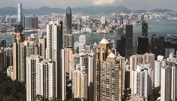 Residential and commercial buildings are seen from Victoria Peak in Hong Kong. Private bankers in Hong Kong and Singapore had their wings clipped by the pandemic, thwarting their pursuit of millionaires scattered across a region where wealth is growing faster than anywhere else.