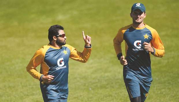 Pakistanu2019s Azhar Ali (left) and teammate Shaheen Afridi take part in a training session on the eve of their third Test against England at Ageas Bowl in Southampton, United Kingdom. (Reuters)