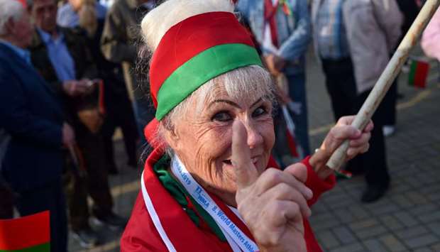 A woman attends a rally in Minsk in support of Belarusian President Lukashenko.