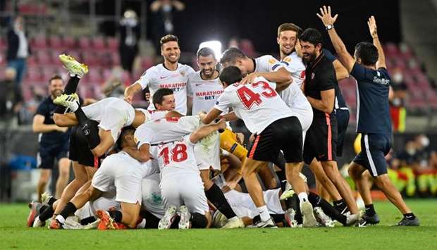 Sevilla's players celebrate winning at the end of the UEFA Europa League final football match Sevilla v Inter Milan