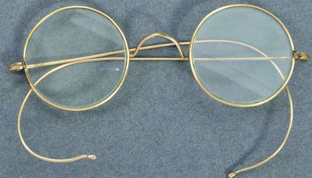 This photo taken on August 19, released by East Bristol Auctions, shows the pair of glasses that once belonged to Gandhi, photographed at the action house in Bristol head of their sale.
