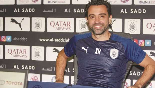 Al Sadd coach Xavi Hernandez is all smiles during a press conference Sunday.