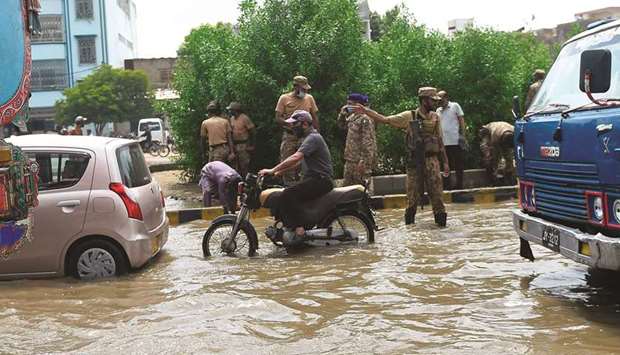 Pakistani army soldiers take part of rescue operation in a flooded area after heavy monsoon rains in the Pakistanu2019s port city of Karachi.