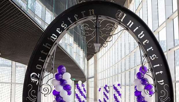 The Weber Arch at Northwestern University in Qatar. Purple and white balloons decorate the space in preparation for NU-Q's annual March Through the Arch.