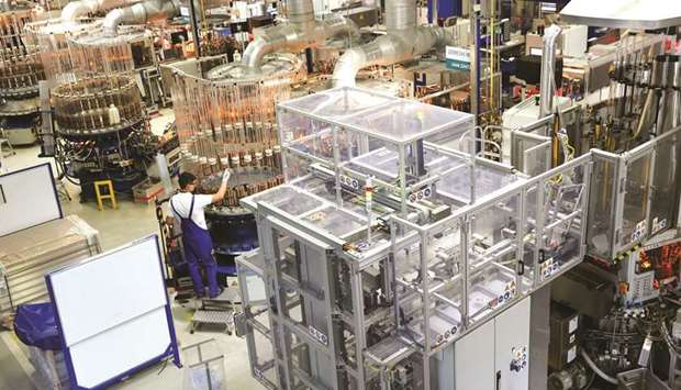 An employee monitors the production line at the Gerresheimer medical glassware factory in Buende, Germany. The Ifo survey recorded the strongest gains in business morale among manufacturers and service providers while sentiment among construction firms was also improving.