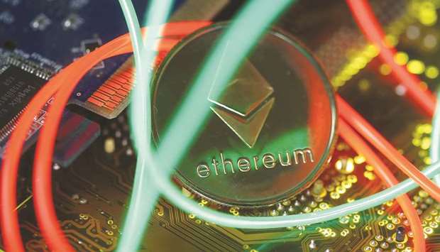 Representation of the Ethereum virtual currency standing on the PC motherboard is seen in an illustration picture. Proponents say DeFi sites, which run on open-source code with algorithms that set rates in real-time based on supply and demand, represent the future of financial services, providing a cheaper, more efficient and accessible way for people and companies to access and offer credit.