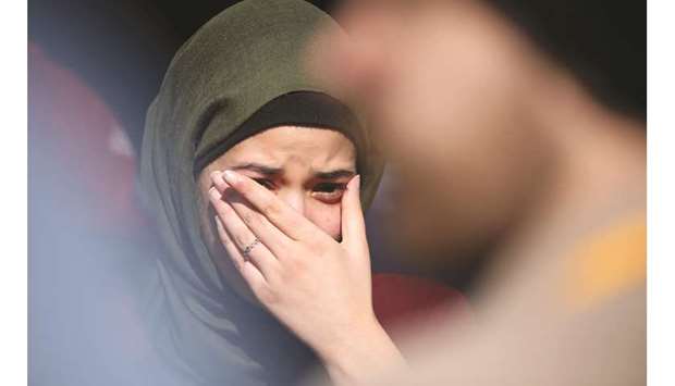 A family member of a victim cries after the judgement.