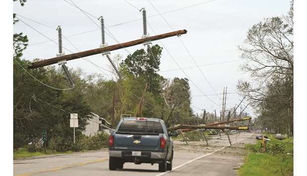 Downed power lines are seen on Highway 90 after Hurricane Laura passed through Iowa, Louisiana.