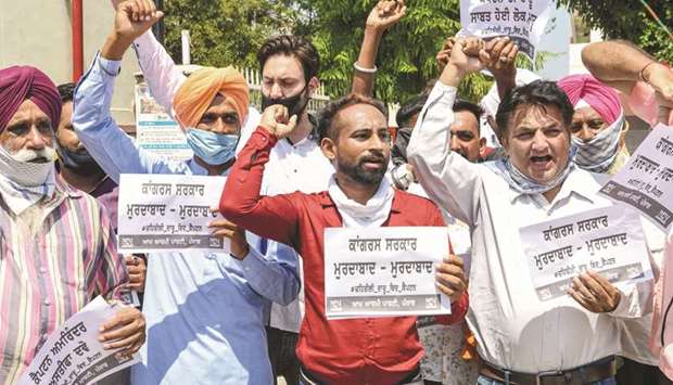 Aam Aadmi Party (AAP) protesters accuse the Punjab government of u2018negligenceu2019 near a civil hospital in Tarn Taran some 25kms from Amritsar yesterday.